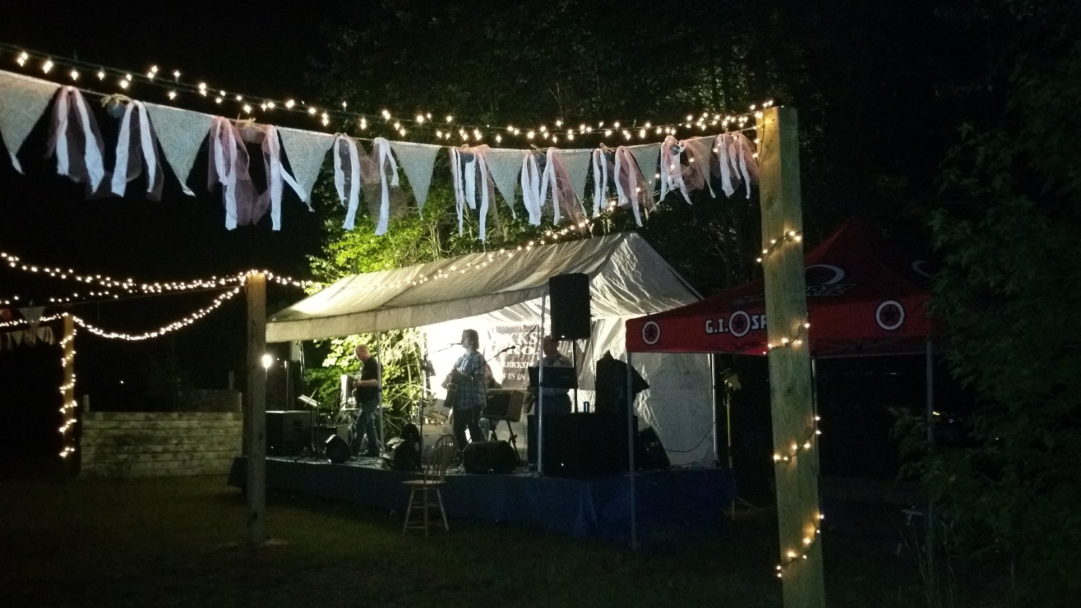 Outdoor live music and string lights at night